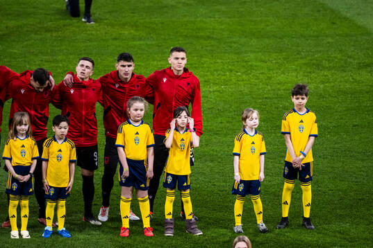 Players of Albania with mascots