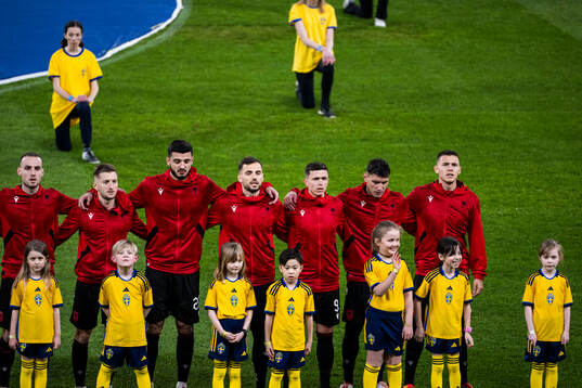 Players of Albania with mascots