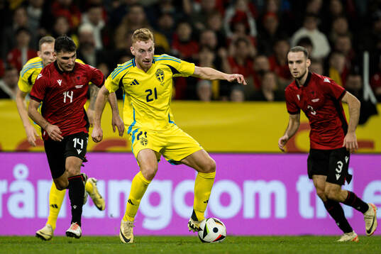 Qazim Laci and Mario Mitaj of Albania and Dejan Kulusevski
