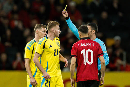 Dejan Kulusevski of Sweden receives a yellow card