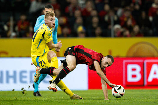 Dejan Kulusevski of Sweden and Mario Mitaj of Albania