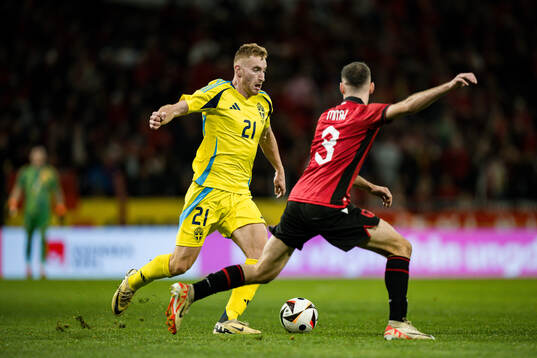 Dejan Kulusevski of Sweden and Mario Mitaj of Albania