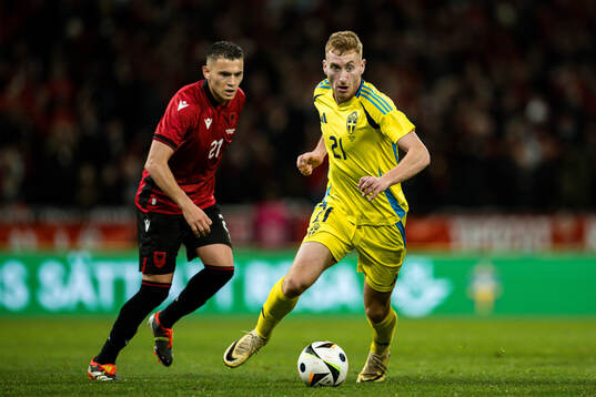Kristjan Asllani of Albania and Dejan Kulusevski of Sweden