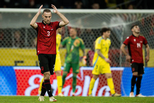 Mario Mitaj of Albania looks dejected