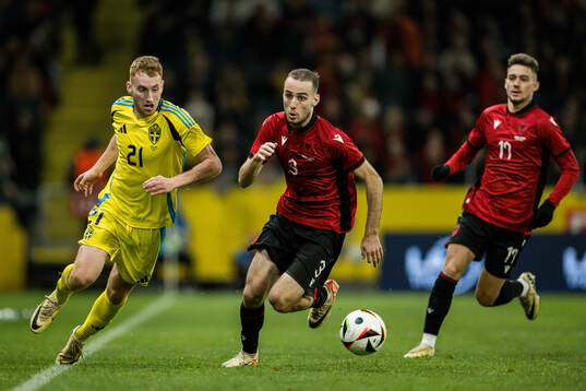Dejan Kulusevski of Sweden and Mario Mitaj of Albania