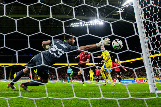 Gustaf Nilsson of Sweden scores 1-0 behind goalkeeper