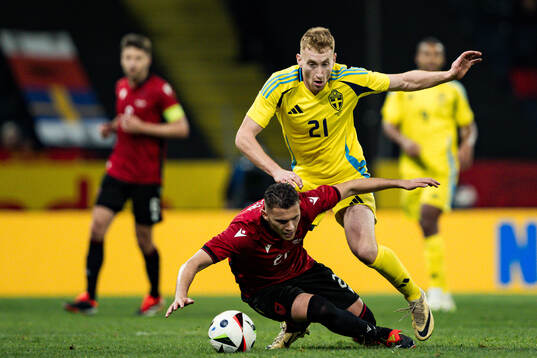 Kristjan Asllani of Albania and Dejan Kulusevski of Sweden