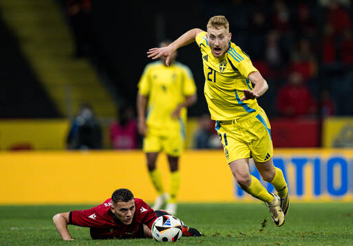 Kristjan Asllani of Albania and Dejan Kulusevski of Sweden