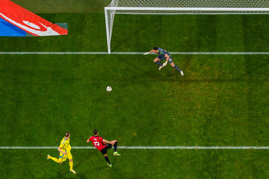 Gustaf Nilsson of Sweden scores 1-0 behind goalkeeper
