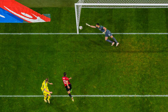 Gustaf Nilsson of Sweden scores 1-0 behind goalkeeper