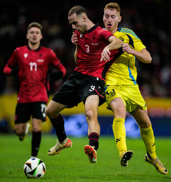 Mario Mitaj of Albania and Dejan Kulusevski of Sweden