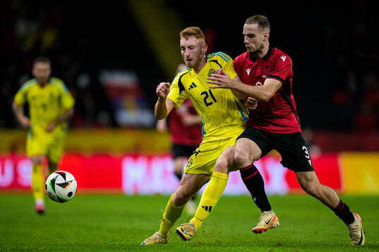 Dejan Kulusevski of Sweden and Mario Mitaj of Albania