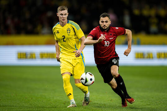 Emil Krafth of Sweden and Nedim Bajrami of Albania