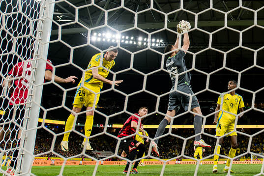 Gustaf Nilsson of Sweden against goalkeeper Thomas