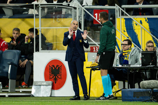 Head coach Sylvinho of Albania and Fourth Official Victor