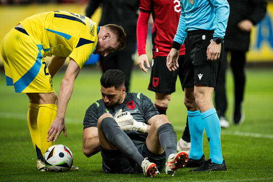 Dejan Kulusevski of Sweden and Thomas Strakosha of Albania