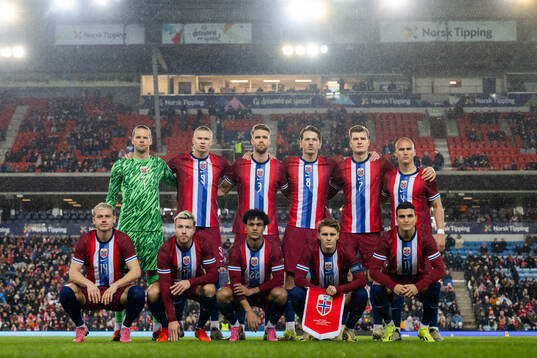 The starting eleven of Norway pose for a team photo