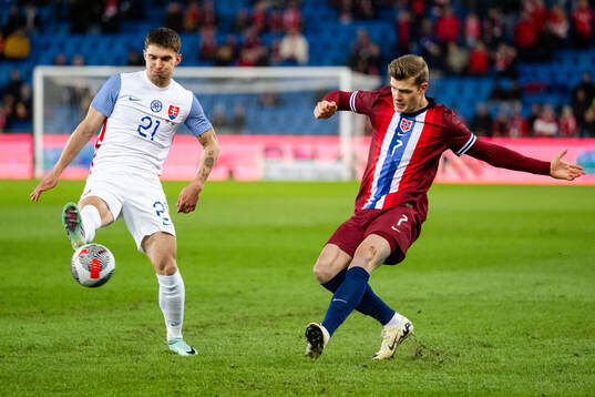 David Duris of Slovakia and Alexander Sørloth of Norway