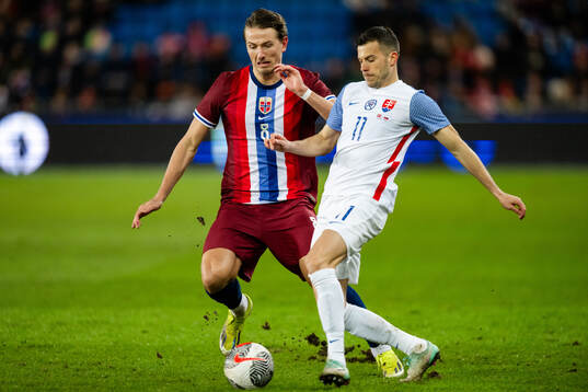 Sander Berge of Norway and Laszlo Benes of Slovakia