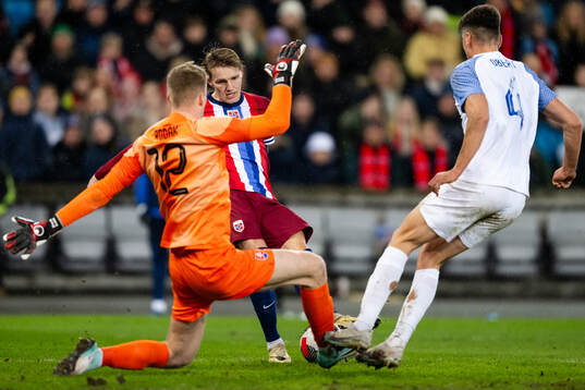 Martin Ødegaard of Norway against goalkeeper Marek Rodak