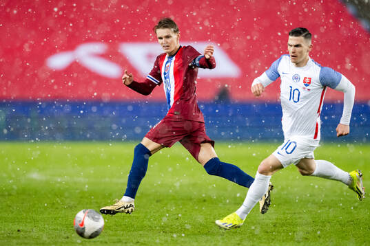 Martin Ødegaard of Norway and Lubomir Tupta of Slovakia