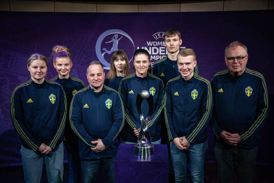 Hosts of team Sweden poses for a picture