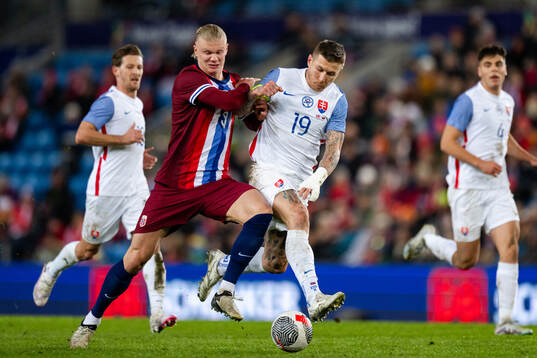 Erling Braut Haaland of Norway and Juraj Kucka of Slovakia