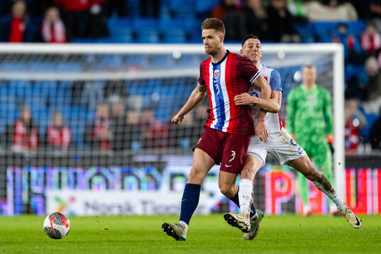 Kristoffer Ajer of Norway and Robert Bozenik of Slovakia