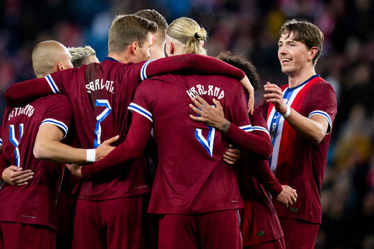 Alexander Sørloth of Norway celebrates with Sander Berge