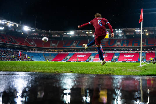 Patrick Berg of Norway takes a corner kick