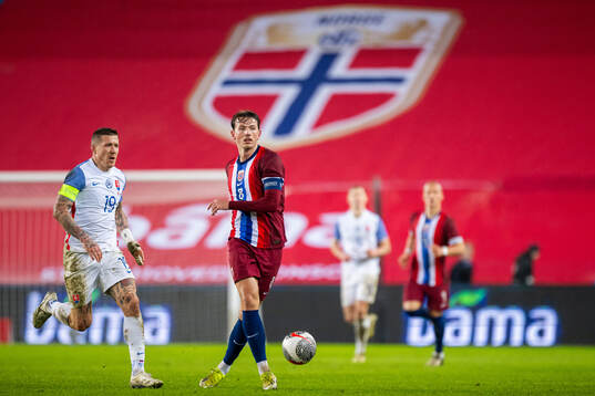 Juraj Kucka of Slovakia and Sander Berge of Norway