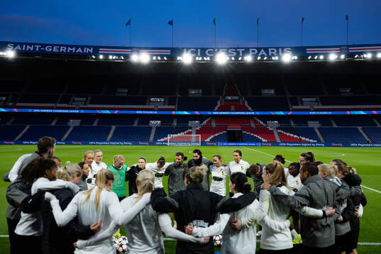 Players and staff gathered