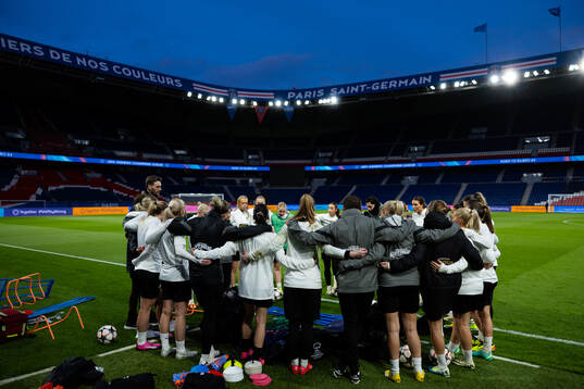 Players and staff gathered