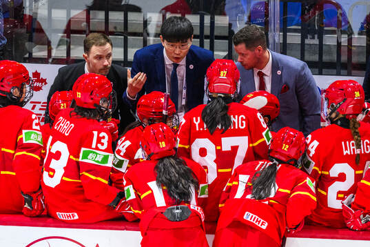 Head coach Xueqin Wei and players of China