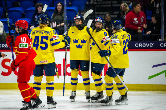 Hanna Olsson of Sweden celebrates with teammates