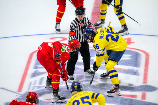 Xin Fang of China, Referee Melissa Doyle and Hanna Olsson
