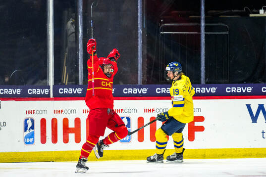 Minghui Kong of China celebrates scoring 7-1