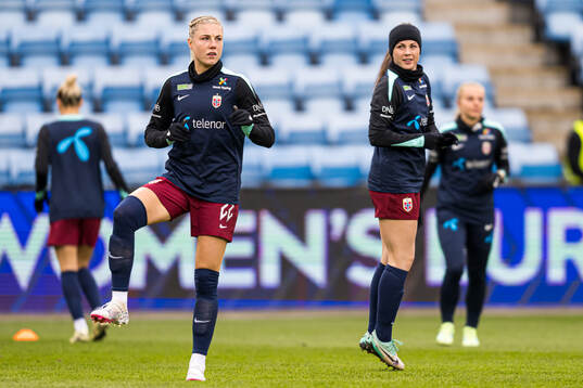 Sophie Roman Haug and Tuva Hansen of Norway warms up