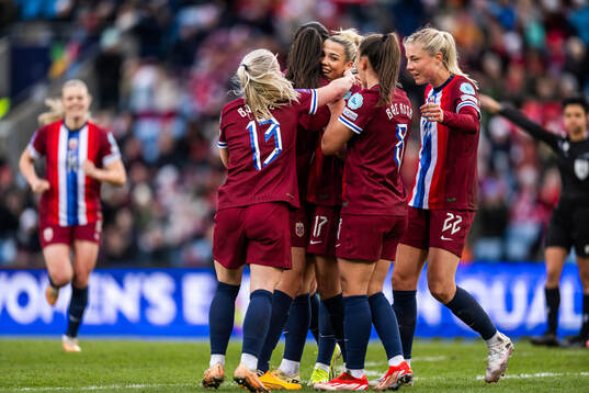 Celin Bizet Ildhusøy of Norway celebrates with team mates