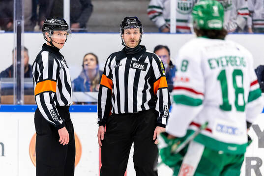 Domare Christoffer Holm och Domare Daniel Eriksson