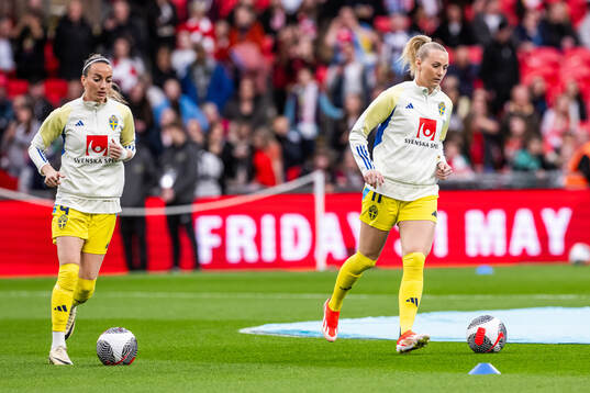 Kosovare Asllani and Stina Blackstenius of Sweden