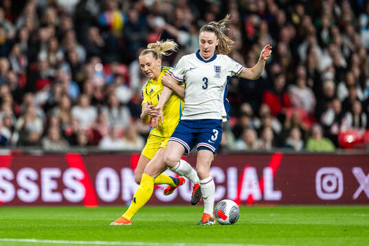 Stina Blackstenius of Sweden and Niamh Charles of England