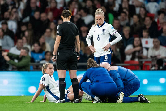 Keira Walsh of England receives medical attention