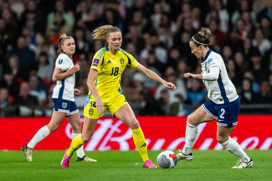 Fridolina Rolfö of Sweden and Lucy Bronze of England
