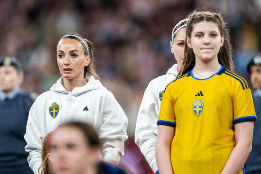 Kosovare Asllani and goalkeeper Jennifer Falk of Sweden