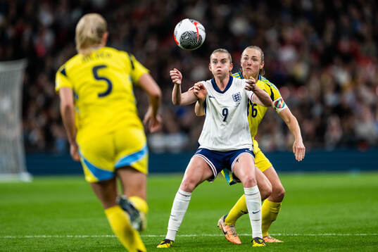 Alessia Russo of England and Magdalena Eriksson of Sweden