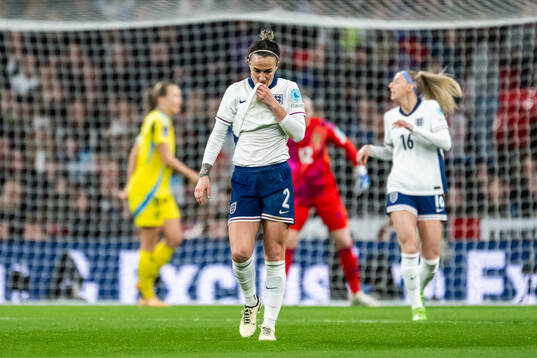 Lucy Bronze of England looks dejected