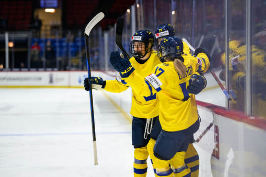 Sara Hjalmarsson of Sweden celebrates with teammates