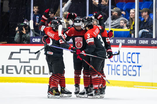 Makoto Ito of Japan celebrates with teammates