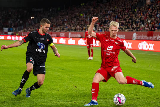 Julius Magnusson of Fredrikstad and Magnus Warming of Brann